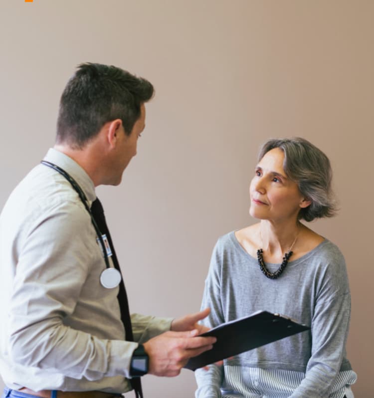 Patient talking to her doctor.