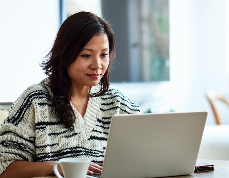 Woman looking at a laptop. Woman looking at a laptop.