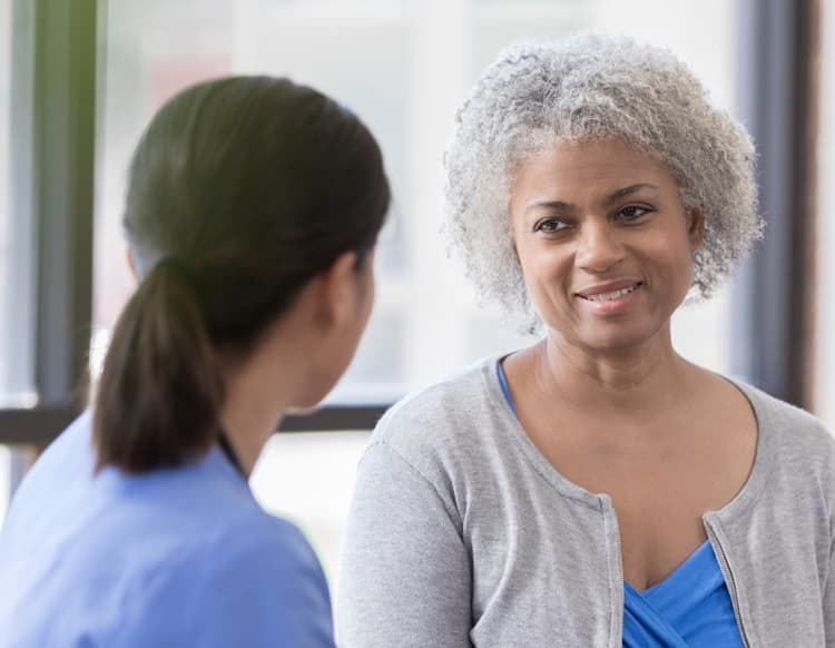 Patient talking to her doctor.