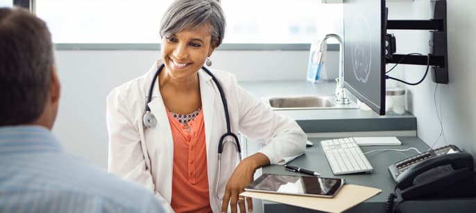 Doctor talking to her patient. Doctor talking to her patient.