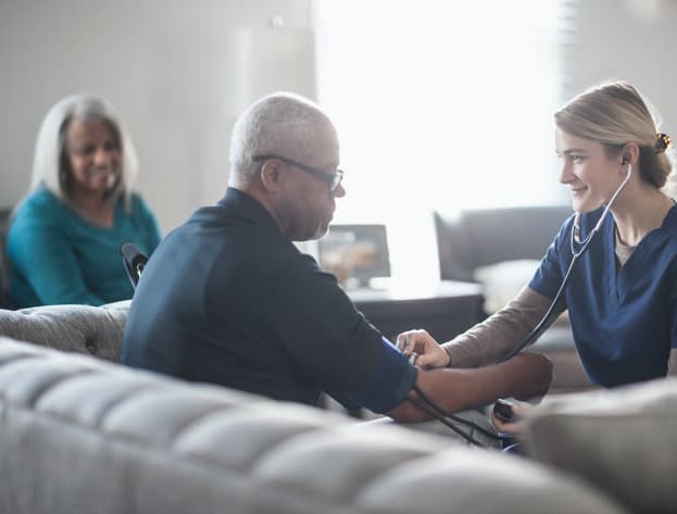 Nurse checking on her patient. GAMMAGARD LIQUID has different dosing and administration. Nurse checking on her patient. GAMMAGARD LIQUID has different dosing and administration.