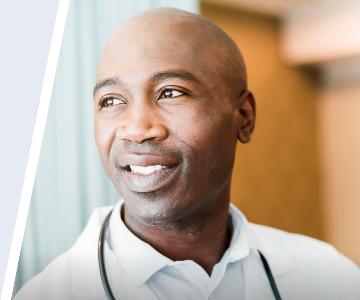 Smiling doctor specializing in primary immunodeficiency.