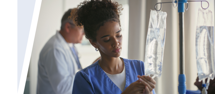Nurse preparing an IV for a patient.